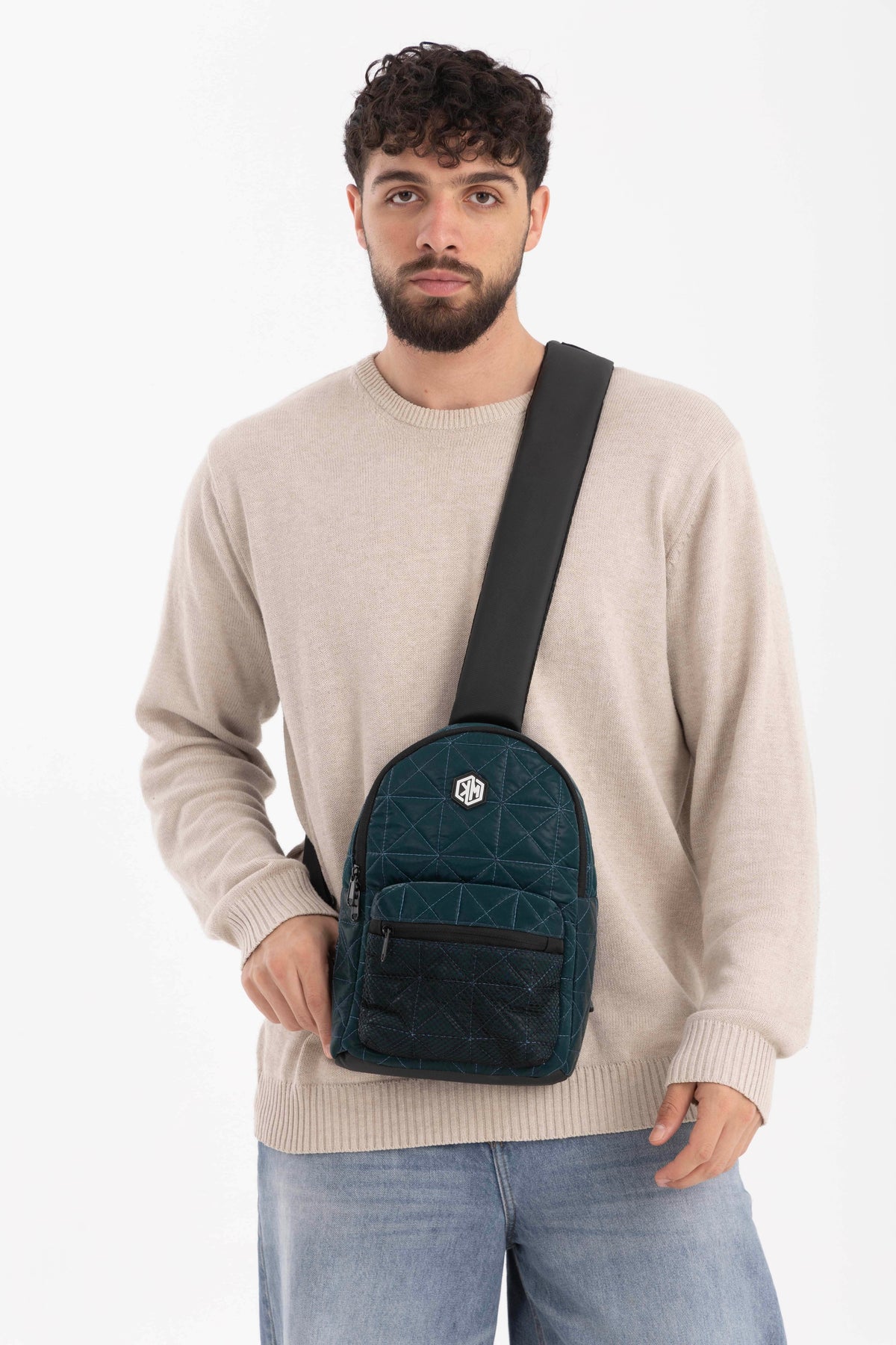 Travel Mate Crossbody Sling Backpack – Petrol by KM Signee – compact quilted crossbody bag, image 1 of 7