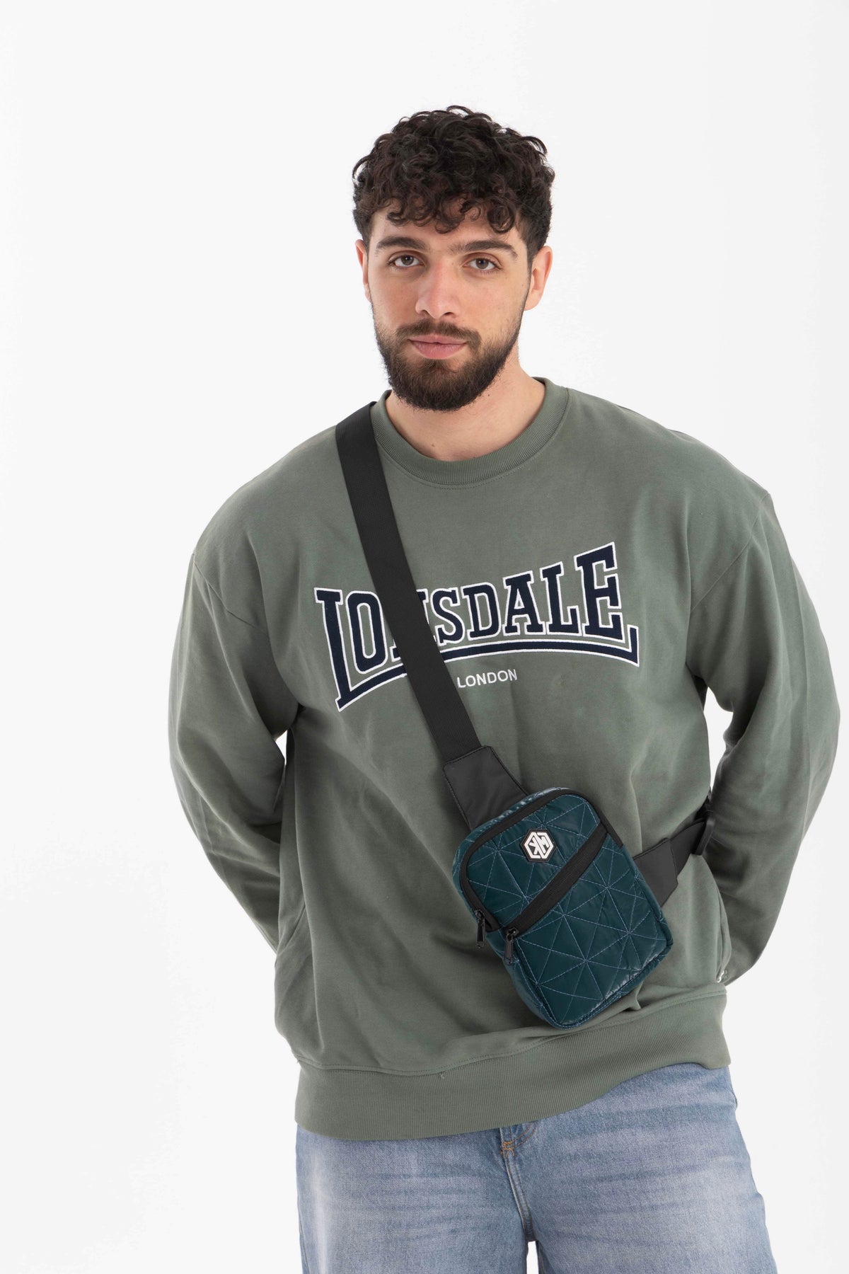 Petrol Travel Mini Sling Crossbody Bag by KM Signee – compact anti-theft crossbody bag, image 1 of 4
