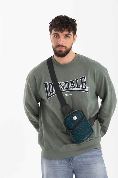 Petrol Travel Mini Sling Crossbody Bag by KM Signee – compact anti-theft crossbody bag, image 1 of 4